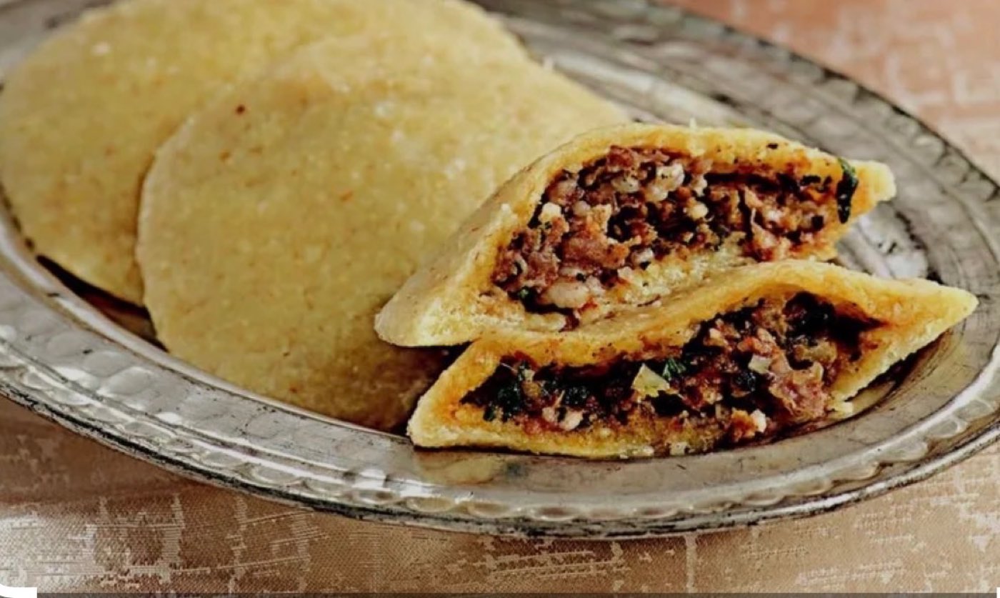 Stuffed meat pies on a silver platter