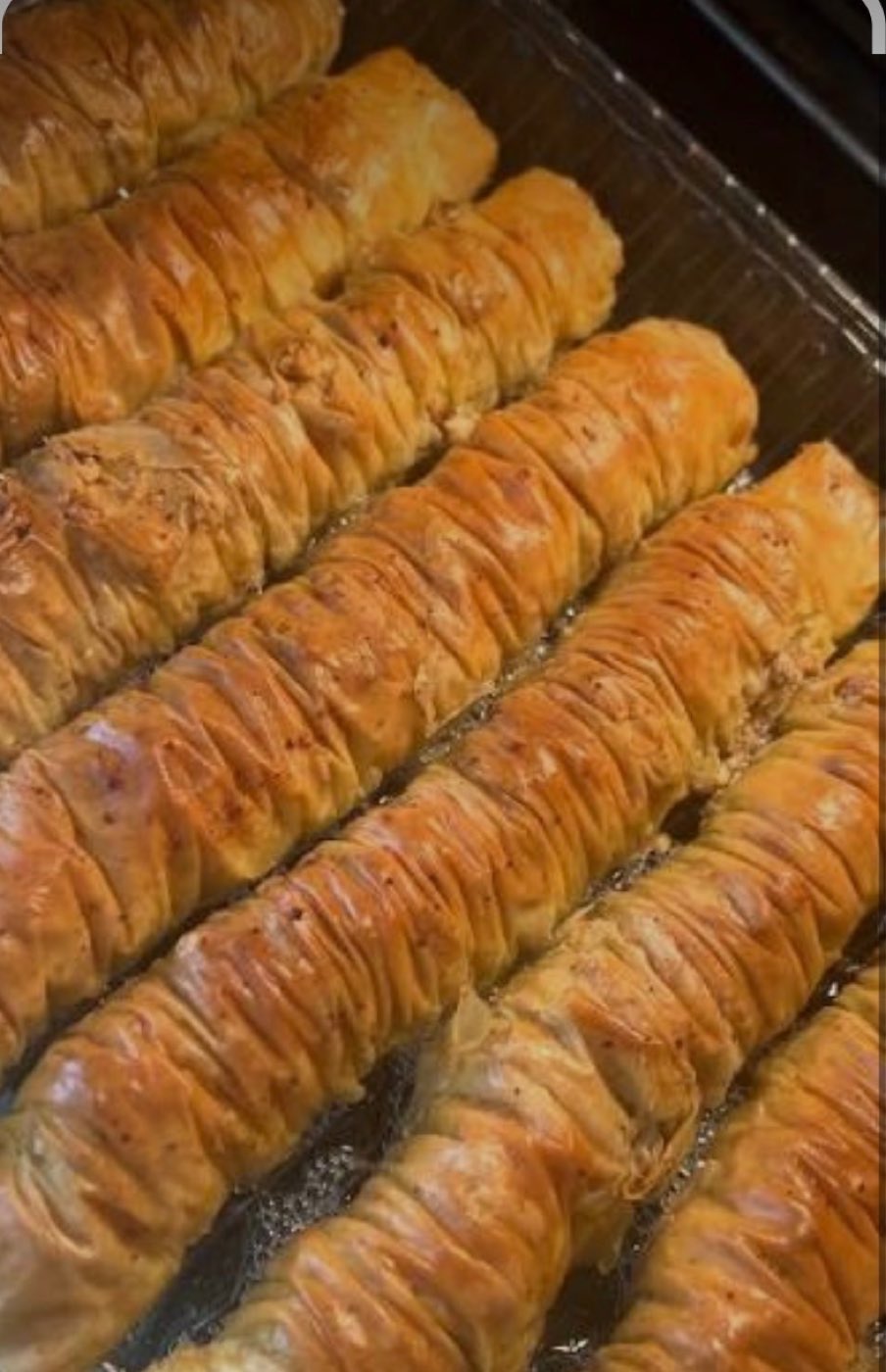 Trays of fresh-baked baklava rolls